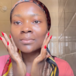 Woman applying A-Ret gel retinol serum in the washroom at night